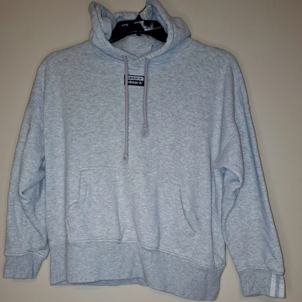 An Adidas hoodie in a mens size small. It's pre-loved and in great condition.